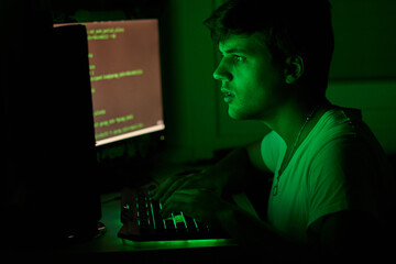 teenager hacking something from a computer