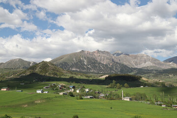 Fototapeta premium Mountain green hill valley village view. Mountain village landscape. Savsat/Artvin/Turkey