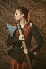 Fighter woman poses with battle axe