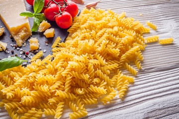 concept of traditional italian pasta with tomatoes and basil