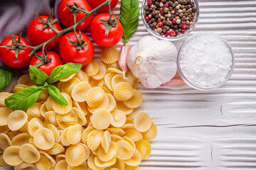 concept of traditional italian pasta with tomatoes and basil