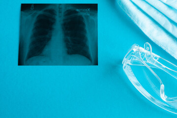 X-ray picture of lungs on the table at the doctor, near medical supplies
