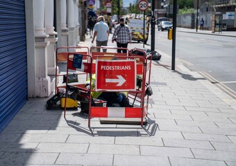 A BT Broadband Engineer working on communications cables in London