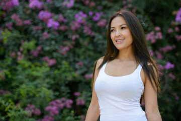 Fototapeta premium Happy beautiful Asian woman thinking at the park outdoors