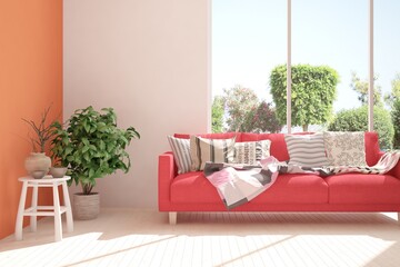 White stylish minimalist room with coral sofa and summer landscape in window. Scandinavian interior design. 3D illustration