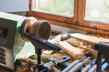 Wood lathe in a carpenter workshop.