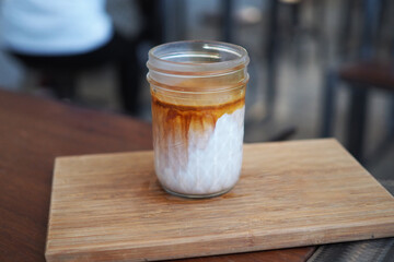 dirty coffee espresso on to fresh milk 