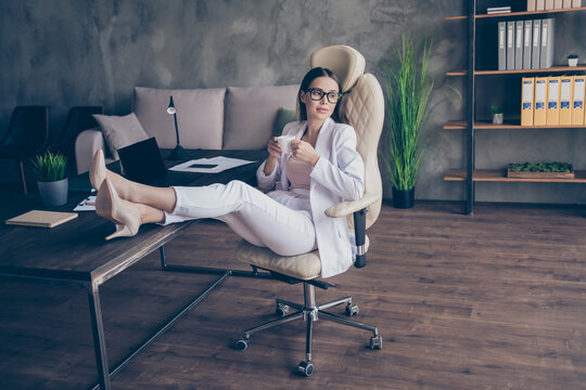 Profile side view of pretty chic classy trendy elegant fit cool lady representative corporate lawyer drinking espresso rest relax chill at modern industrial loft interior workplace workstation