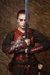 Warrior woman posing with sword