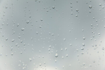 Abstract texture of blurry water drops on glass