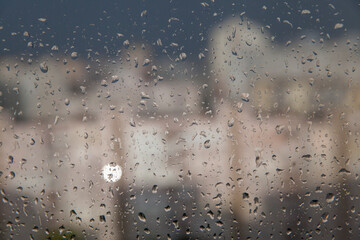 Abstract texture of blurry water drops on glass