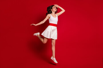 Full size profile photo of funny crazy lady jumping high up good mood rejoicing look far away hand...