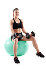 Fototapeta premium Young athletic woman working out with dumbbells