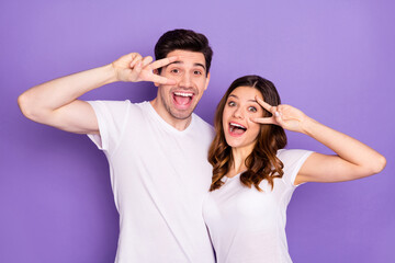 Portrait of excited funky girl guy enjoy summer rest relax make v--sign face expression wear white good look outfit isolated over violet color background