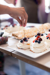 Making homemade meringue, pavlova cakes