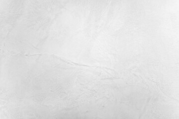 Neutral white colored low contrast Concrete textured background with roughness and irregularities to your concept or product