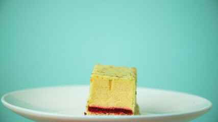 the cut cake rotates on a white plate