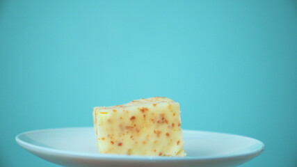 the cut cake rotates on a white plate