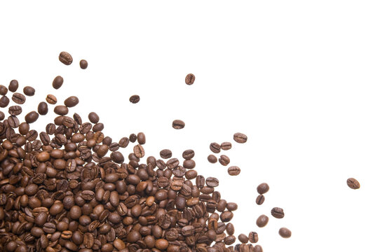 Roasted coffee beans isolated on white background. Close up of a brown surface texture of aroma black caffeine drink ingredient for coffee beverage. © Digihelion