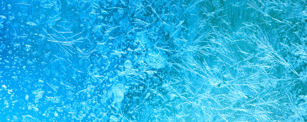 Ice flowers and frozen window macro view. Frost texture pattern. cold winter weather xmas...