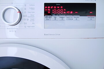 washing machine controls in white stock photo