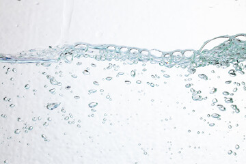 Closeup bubbles underwater on white background.