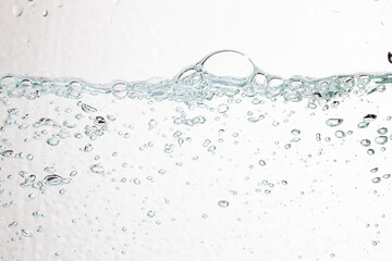 Closeup bubbles underwater on white background.