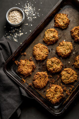 Homemade baked oatmeal cookies with dark background