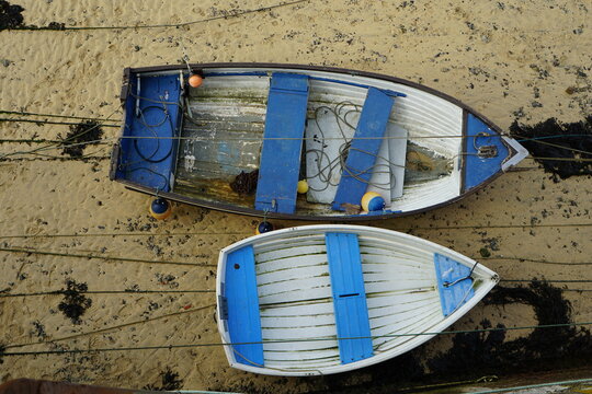White Rowing Boat With Blue Seat Photographed From Above