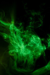 Green smoke motion on black background.