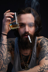 smoking hipster boy with beard and tattoo