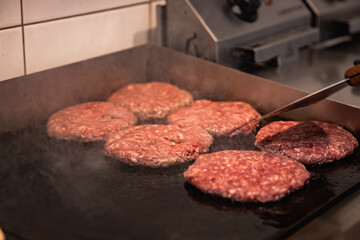 Close-up of beef cutlet, for burger, fried in a pan, grill, cutlet cuddle culinary, cooking process