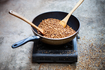Traditional roasting coffee at home,  freshly roasted coffee beans.
