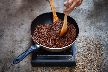 Traditional roasting coffee at home,  freshly roasted coffee beans.