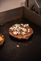 Close-up of beef cutlet, for burger, fried in a pan, grill, cutlet cuddle culinary, cooking process