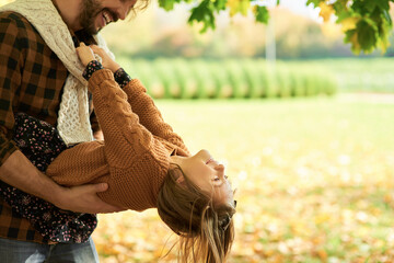 Daddy playing with his little daughter on the fresh air