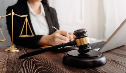 Business and lawyers discussing contract papers with brass scale on desk in office. Law, legal...