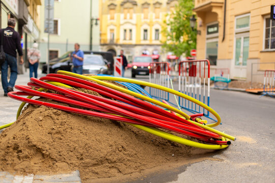 Repair work on city streets. Laying cable routes. Coils of plastic casings
