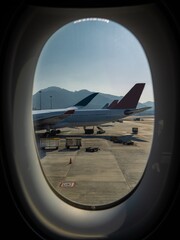 Parked aircraft seen from the window of another aircraft