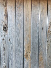 Vertical wavy gray texture from old wooden boards
