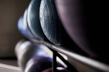 Fitness balls of different colors in gym