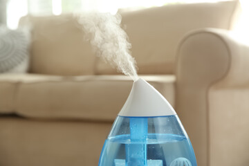 Modern air humidifier at home, closeup view