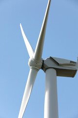 Wind turbine against beautiful sky, closeup. Alternative energy source