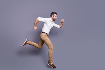 Full length body size view of his he nice attractive glad cheerful cheery man jumping running...