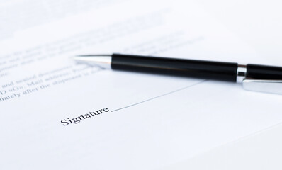 pen on a sheet of paper close-up on a white background. Contracts, business