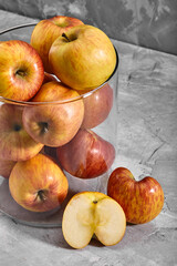 Red-yellow apples on the table. Top view with copy space on gray stone background.