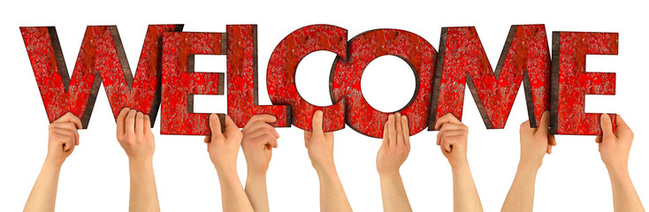 people holding up colorful red wooden letter with word welcome isolated white background. family...