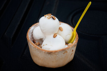 Fototapeta na wymiar Coconut milk ice cream placed in a coconut shell