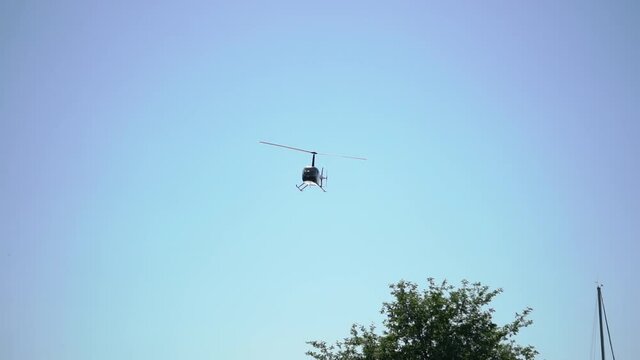 Helicopter flying and landing at airport airfield