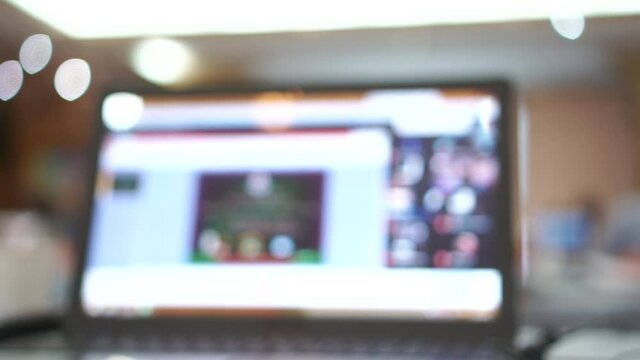 Blurred of Thai Teacher using e-learning for meet application Video conference via computer network to prepare for teaching through e-learning in secondary school in Thailand